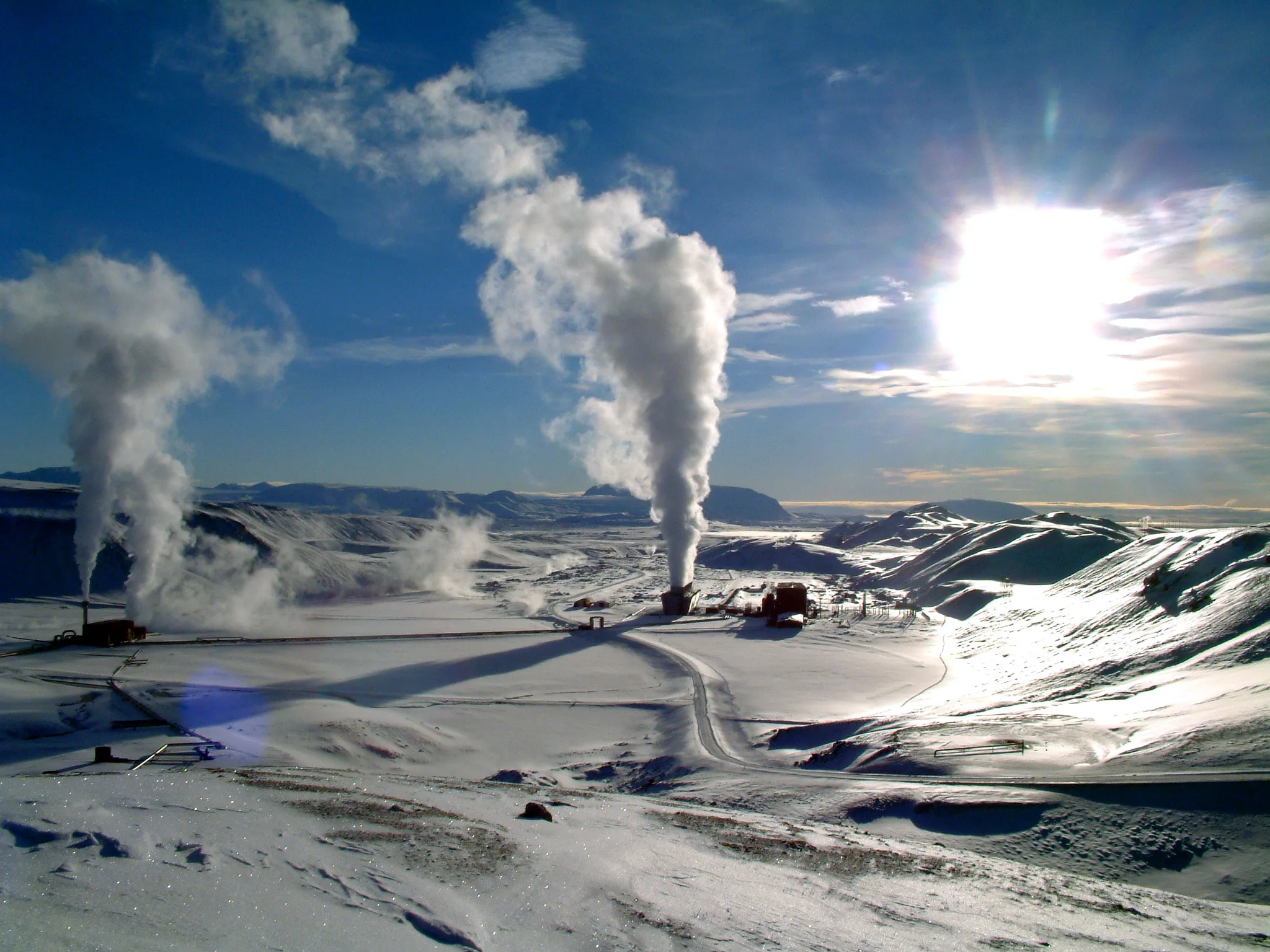 Steam plumes rising from the Krafla geothermal power station across a snow-covered Icelandic landscape
