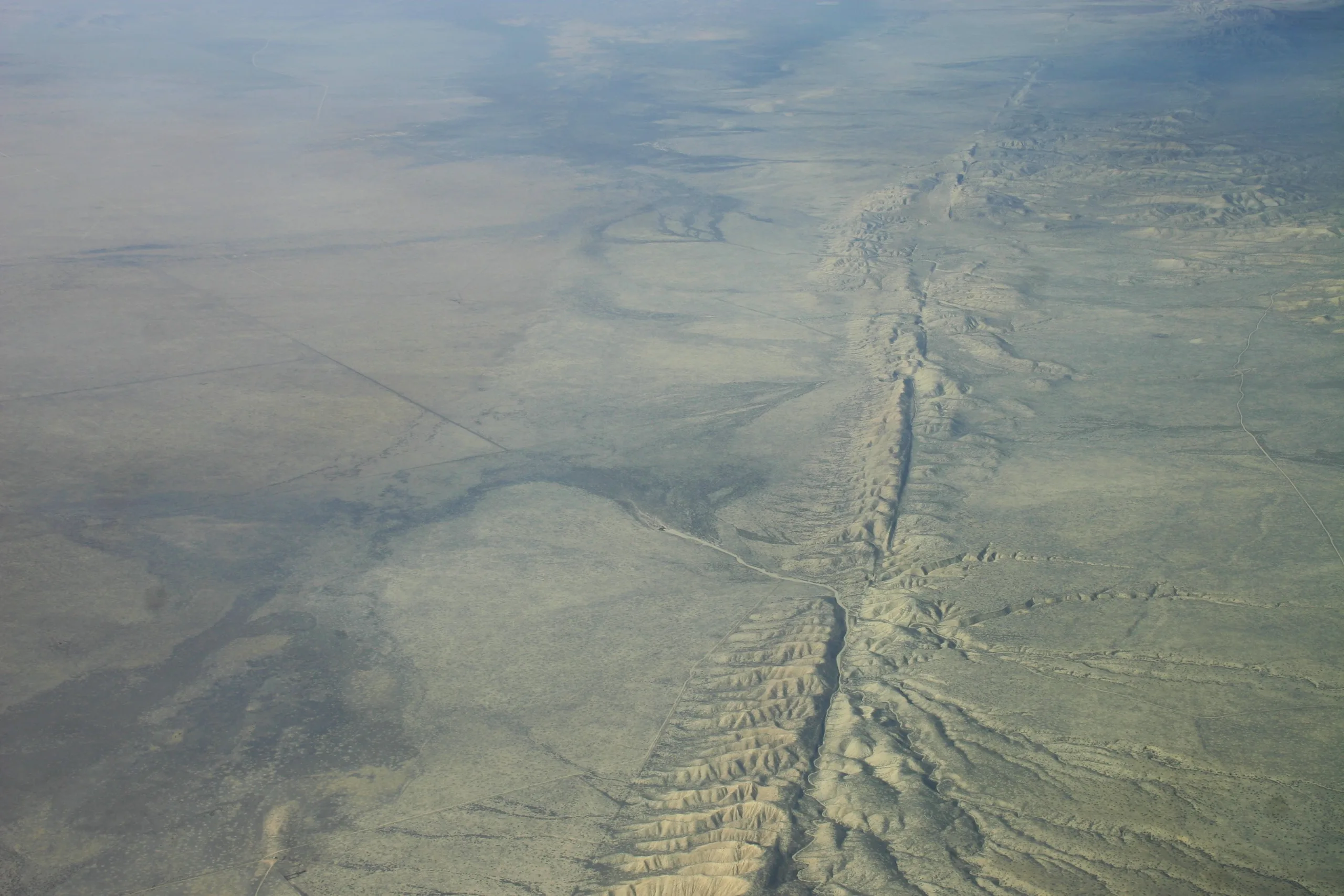 Aerial view of the San Andreas Fault crossing the Carrizo Plain, its trace marked by a line of ridges and offset gullies