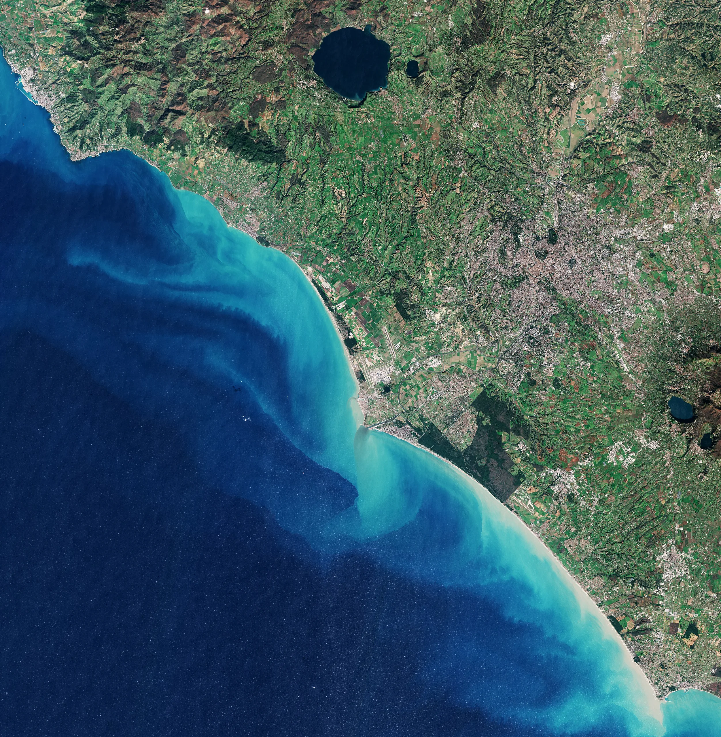 Copernicus Sentinel-2 satellite view of the Tyrrhenian coast around Rome, showing the city, farmland and sediment plumes in the sea